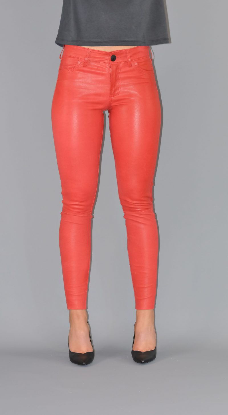 woman wearing red leather pants with a gray top