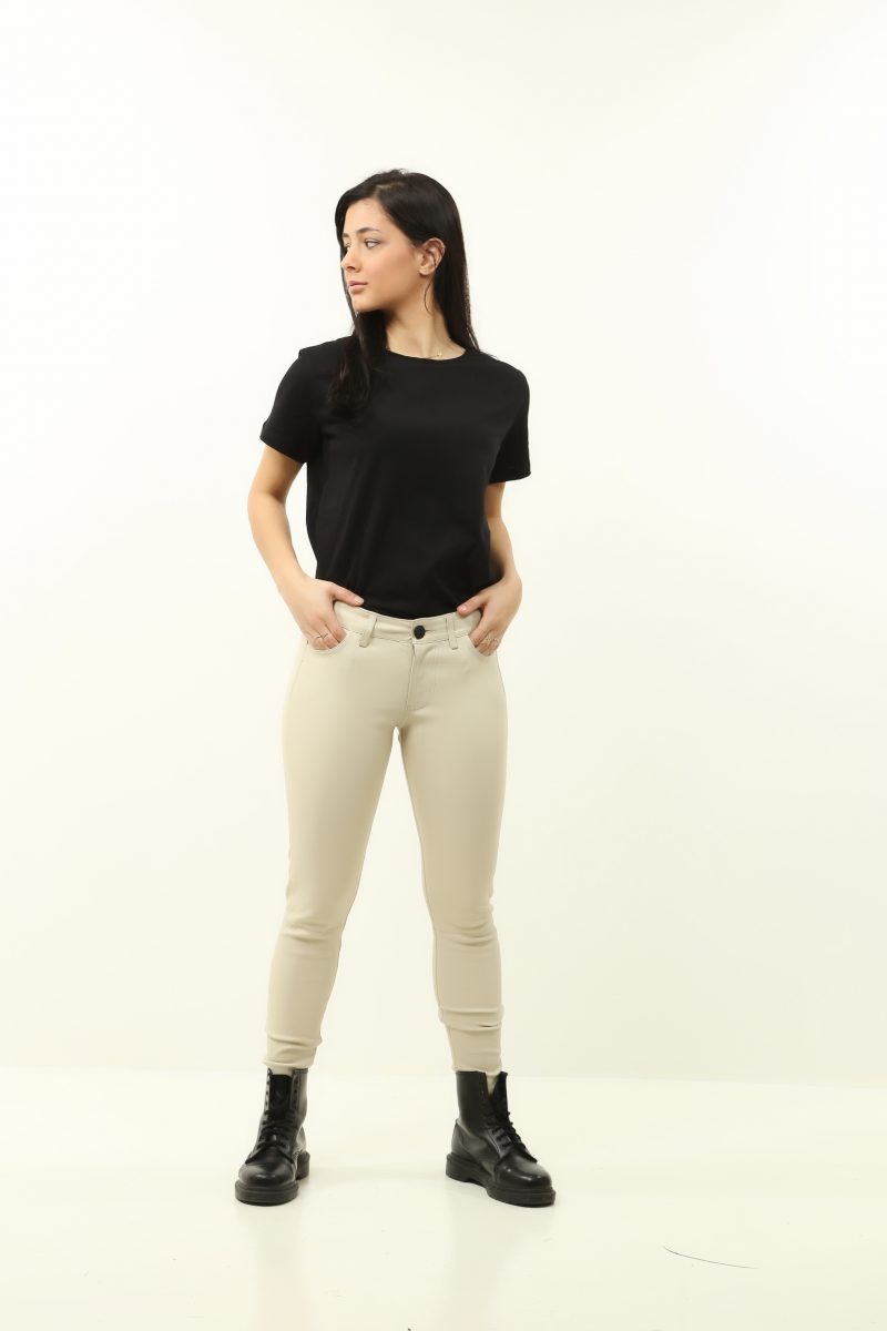 woman wearing black leather pants and white t-shirt on white background