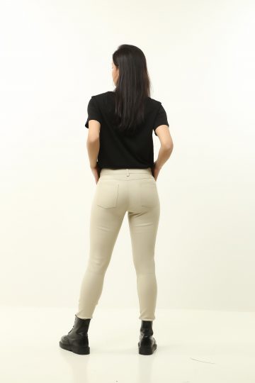 woman wearing white leather pants on white background